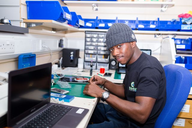 Picture of a man in an electronics workshop